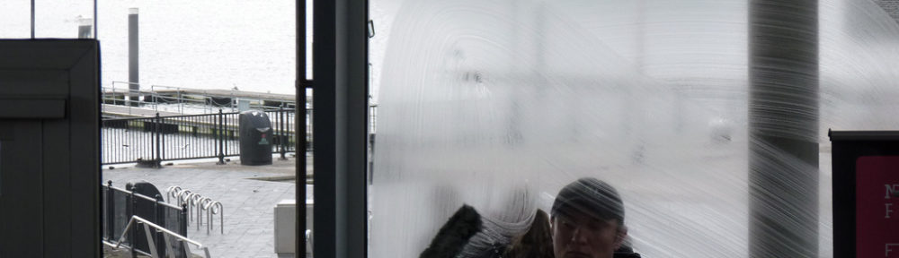 Photo of a man cleaning a window. Photo by Martina on Flickr Creative Commons