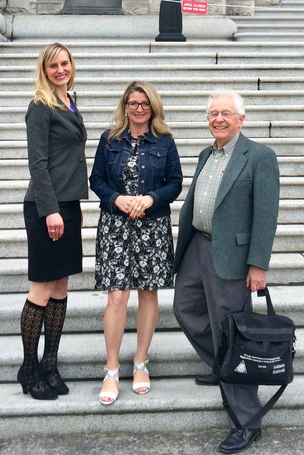Coalition members David Fairey and Anelyse Weiler meeting with Agriculture Minister Lana Popham on the steps of Parliament in Victoria, BC.